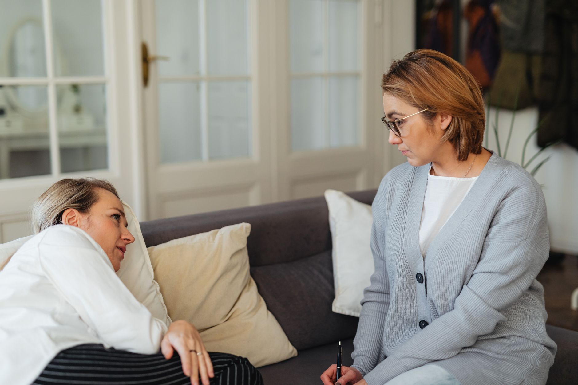 A therapist listening closely to a client